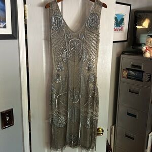 Ready to join the flappers in this amazing hand beaded stretch dress!